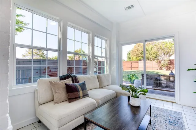 a living room with furniture and windows