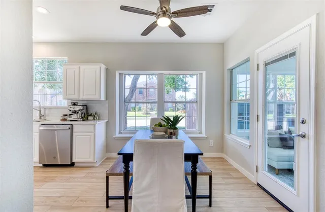 a living room with kitchen island granite countertop furniture and a fireplace