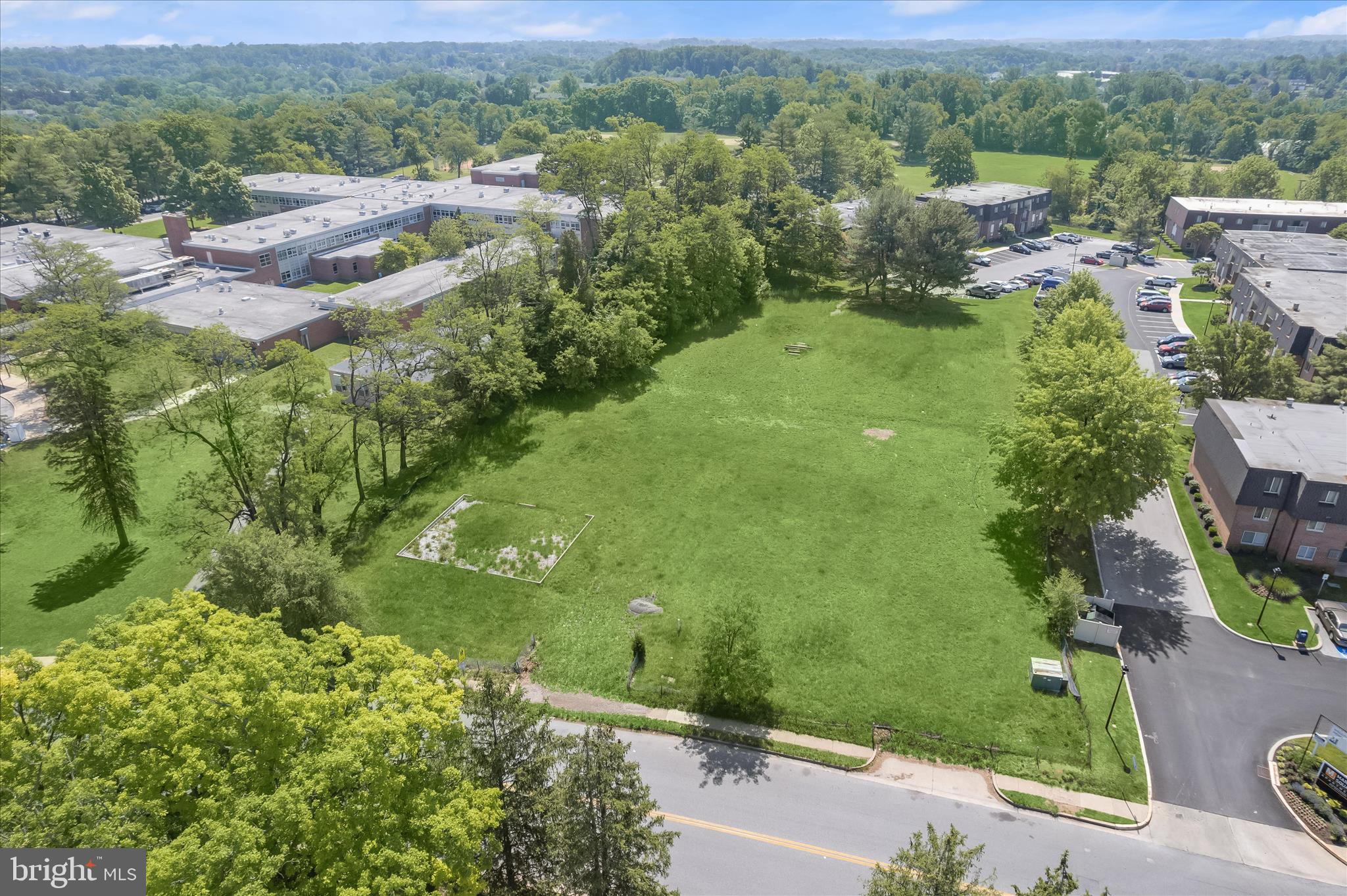 3925 Rolling Rd. Baltimore, MD 21208 - Photo 6 of 27 an aerial view of residential houses with outdoor space and trees