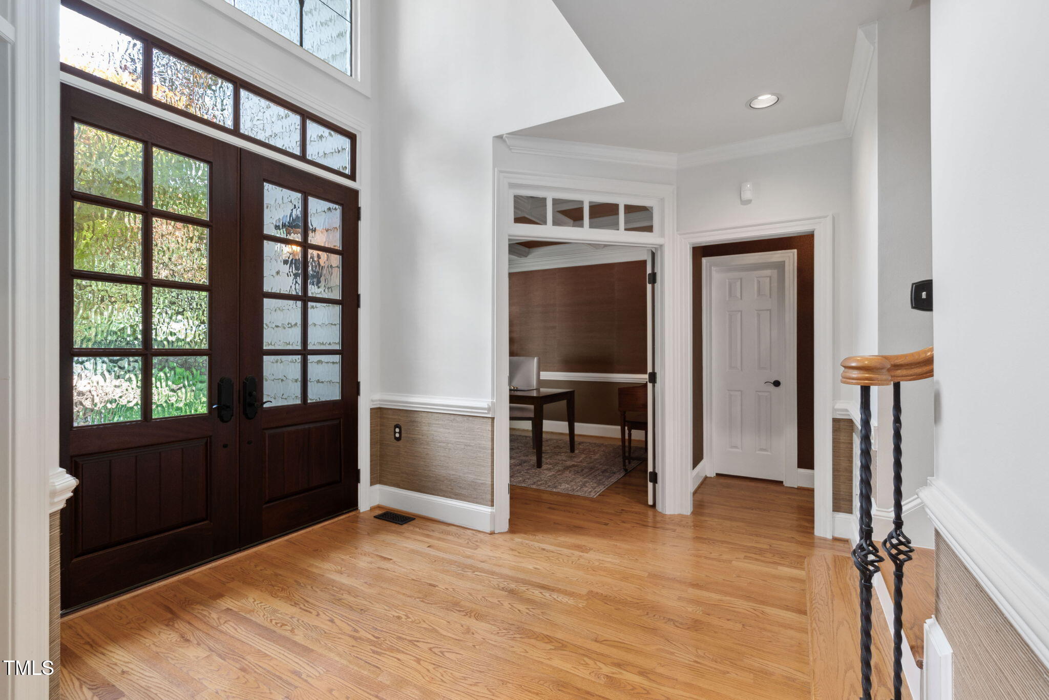 10405 Veasey Mill Road Raleigh, NC 27615 - Photo 23 of 94 a view of a bedroom with furniture window and wooden floor