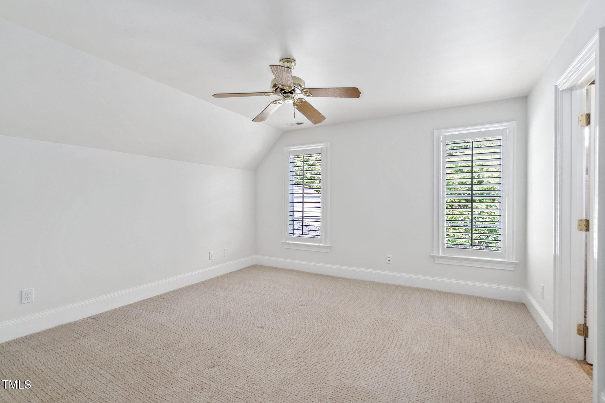 10405 Veasey Mill Road Raleigh, NC 27615 - Photo 38 of 94 an empty room with windows and fan