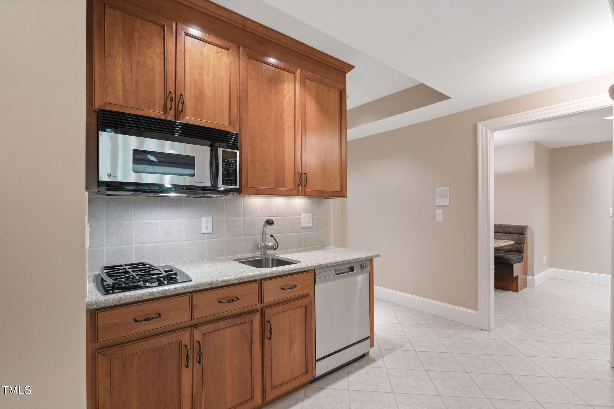 10405 Veasey Mill Road Raleigh, NC 27615 - Photo 46 of 94 a kitchen with stainless steel appliances granite countertop a sink stove and microwave