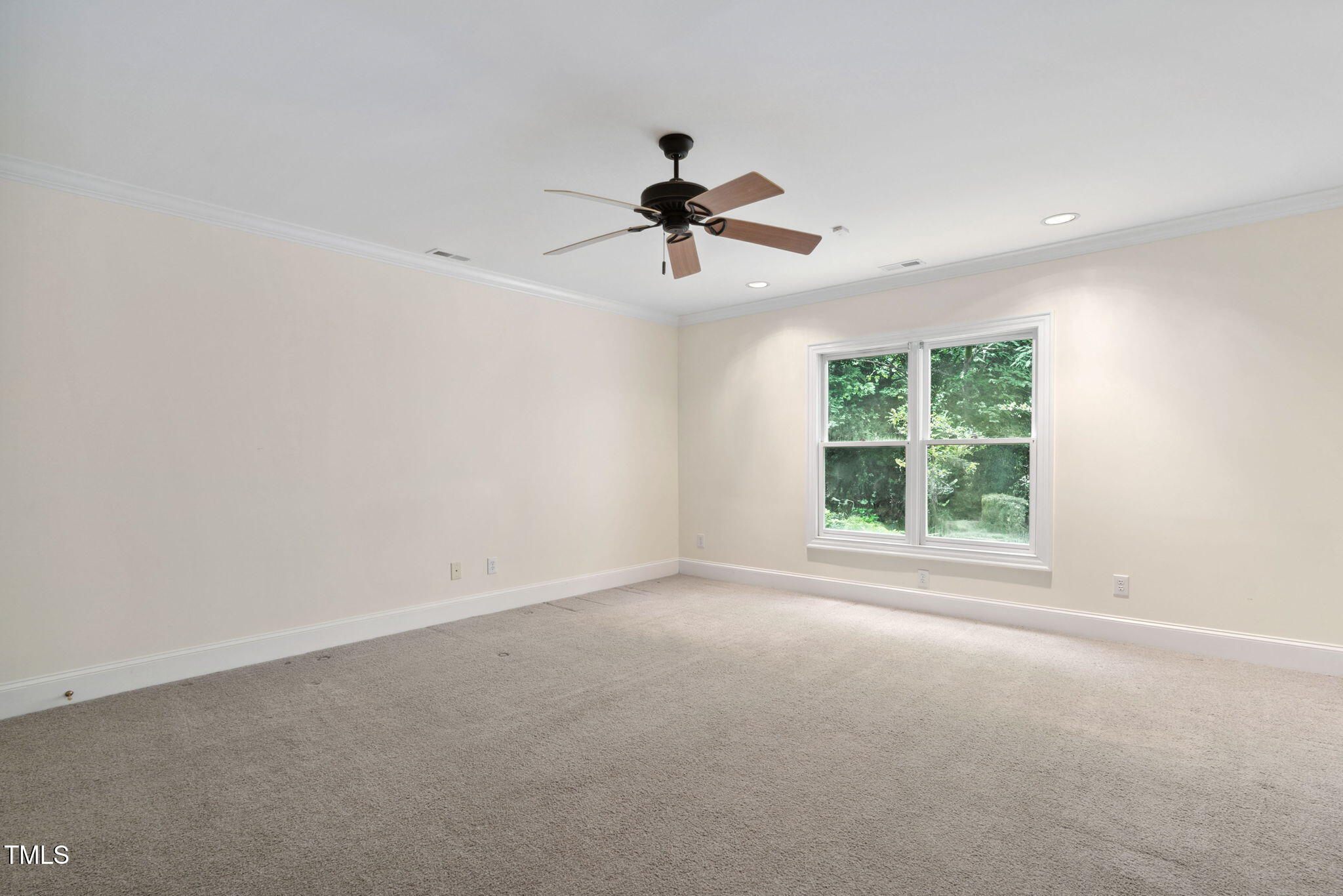 10405 Veasey Mill Road Raleigh, NC 27615 - Photo 48 of 94 a view of a livingroom with a ceiling fan and window