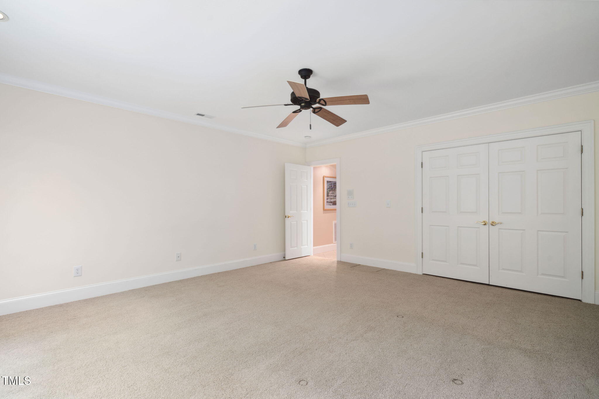 10405 Veasey Mill Road Raleigh, NC 27615 - Photo 49 of 94 a view of a chandelier fan in a room