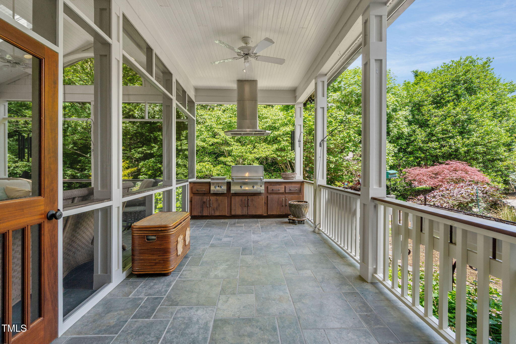 10405 Veasey Mill Road Raleigh, NC 27615 - Photo 61 of 94 a view of a porch with furniture and floor to ceiling window