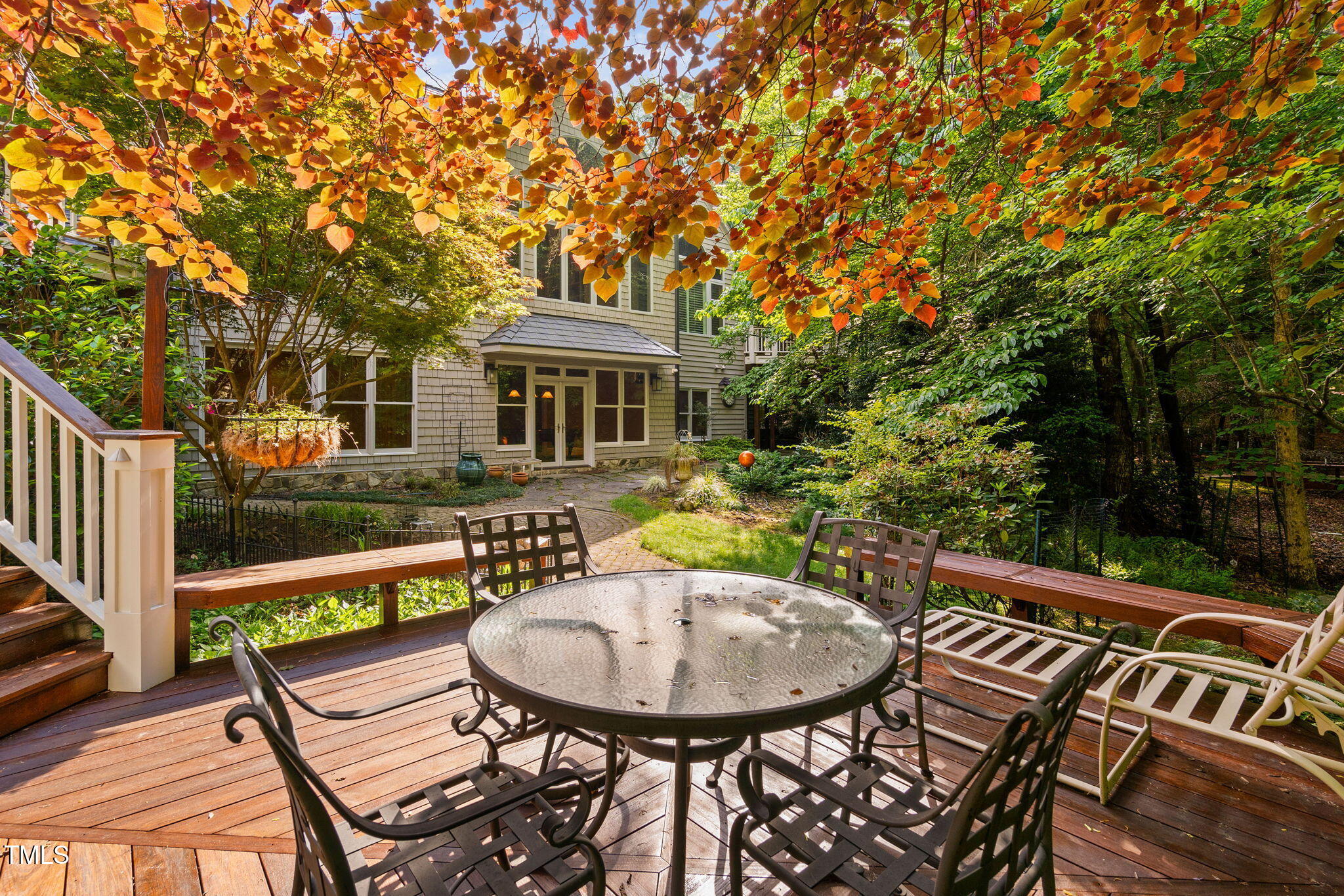 10405 Veasey Mill Road Raleigh, NC 27615 - Photo 64 of 94 a view of a patio with table and chairs and wooden fence with plants