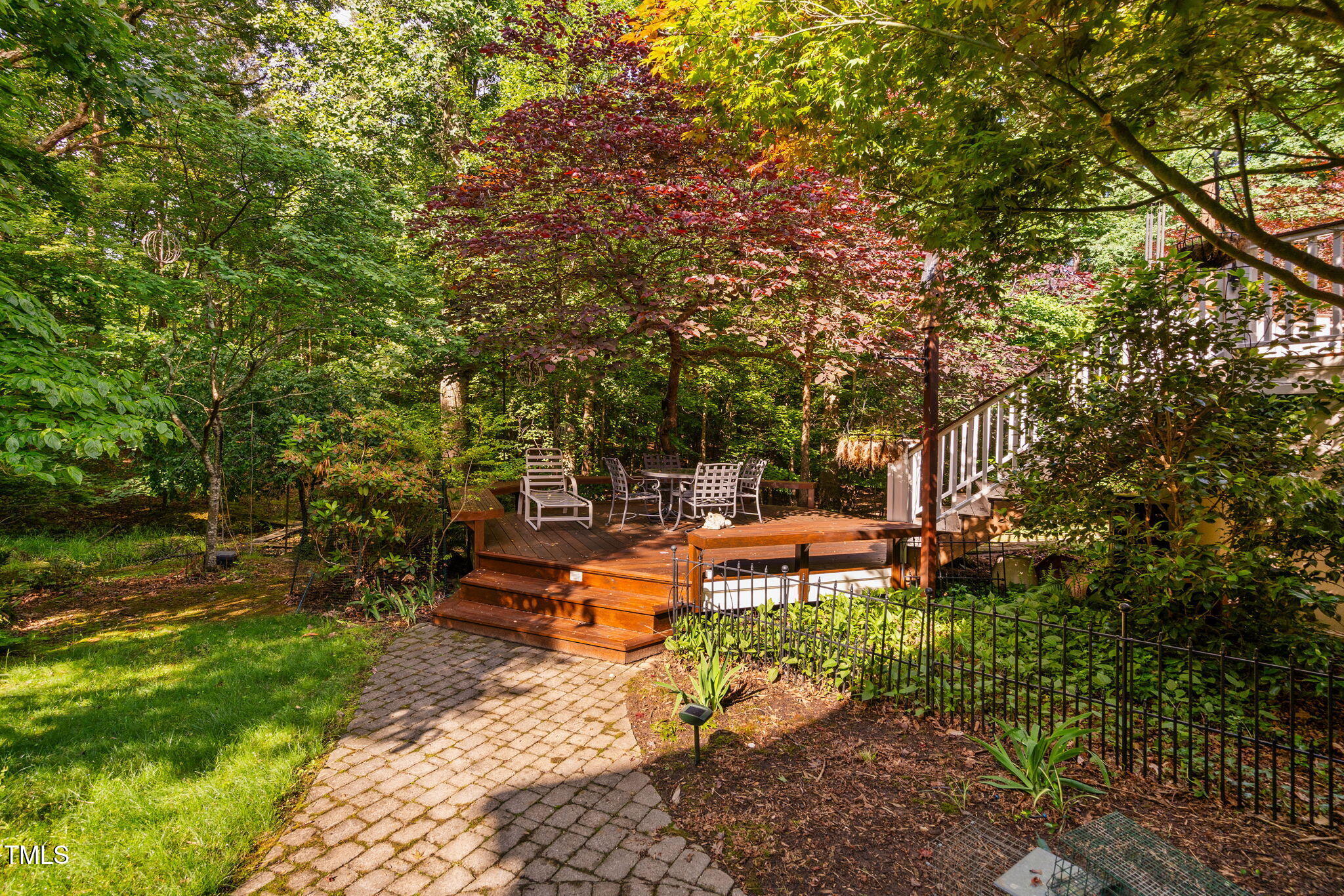 10405 Veasey Mill Road Raleigh, NC 27615 - Photo 67 of 94 a view of a bench in a garden