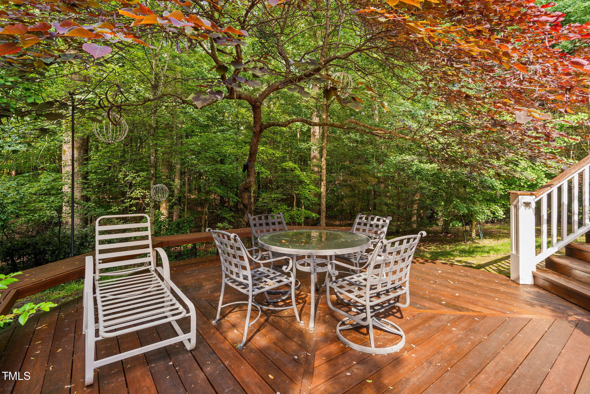 10405 Veasey Mill Road Raleigh, NC 27615 - Photo 82 of 94 a view of a patio with table and chairs and wooden floor
