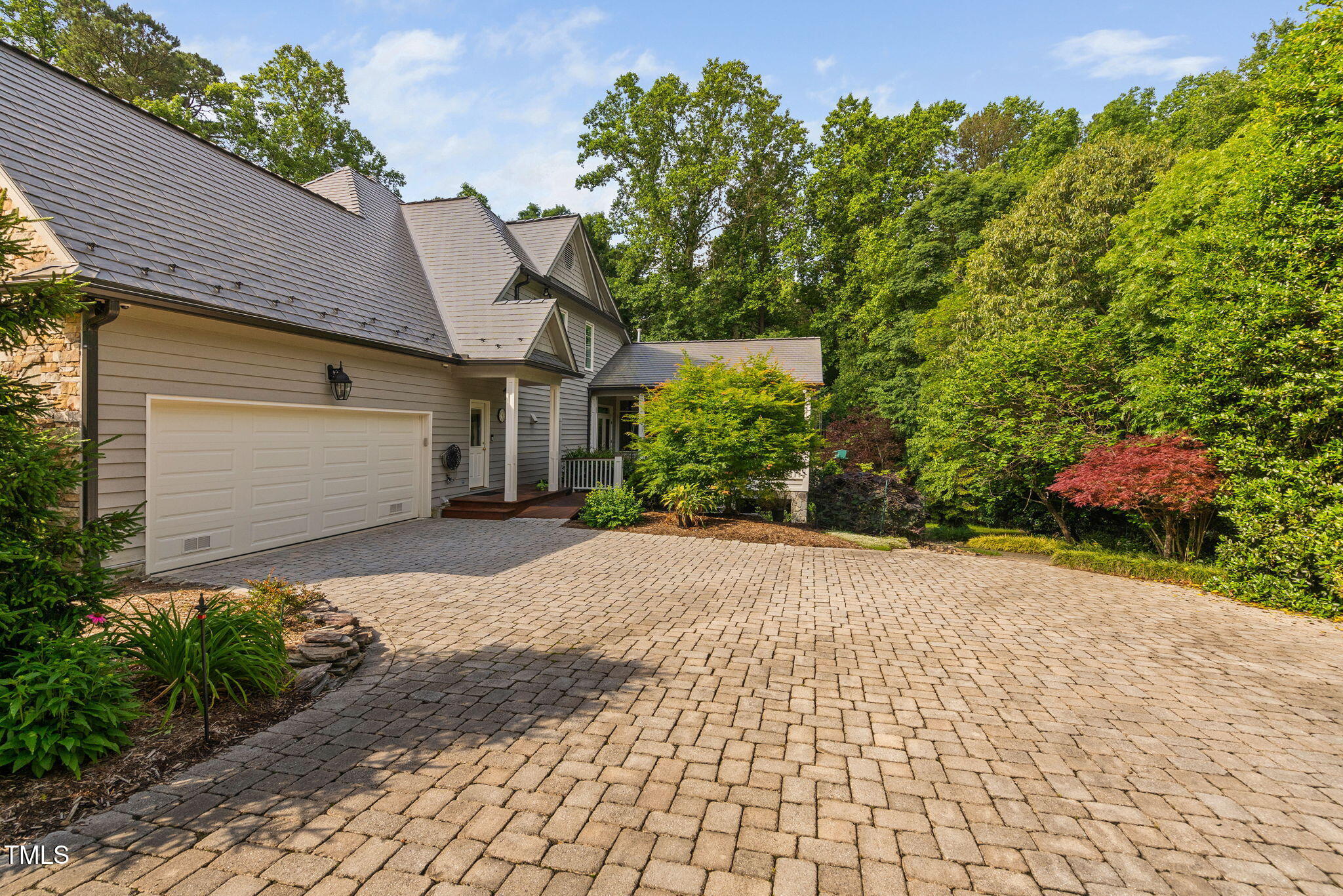 10405 Veasey Mill Road Raleigh, NC 27615 - Photo 90 of 94 a front view of a house with a yard and a garage