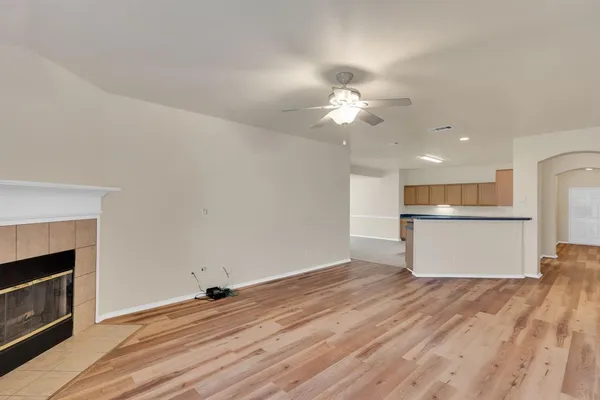 a view of a kitchen with a dishwasher and a fireplace