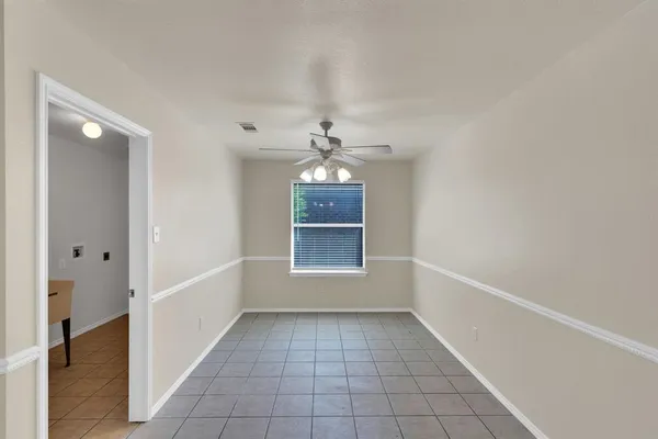 a kitchen that has a sink and a stove in it