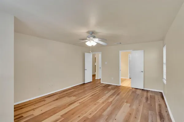 a view of a livingroom with a chandelier fan
