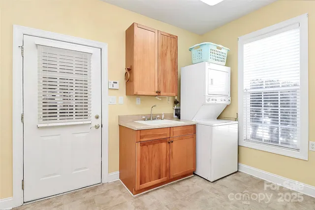 a utility room with closet dryer and washer