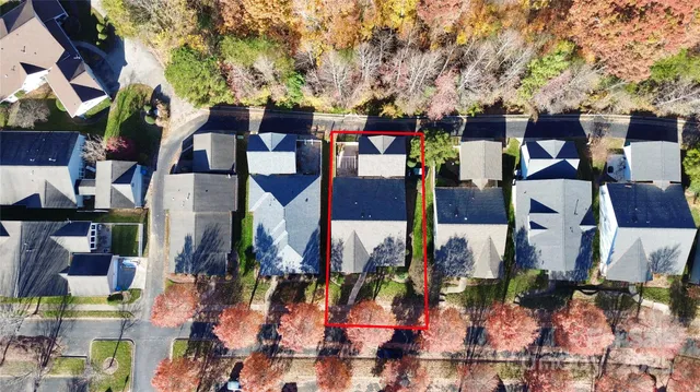 an aerial view of residential houses and outdoor space