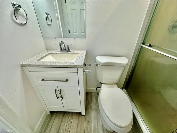 a bathroom with a toilet and a sink