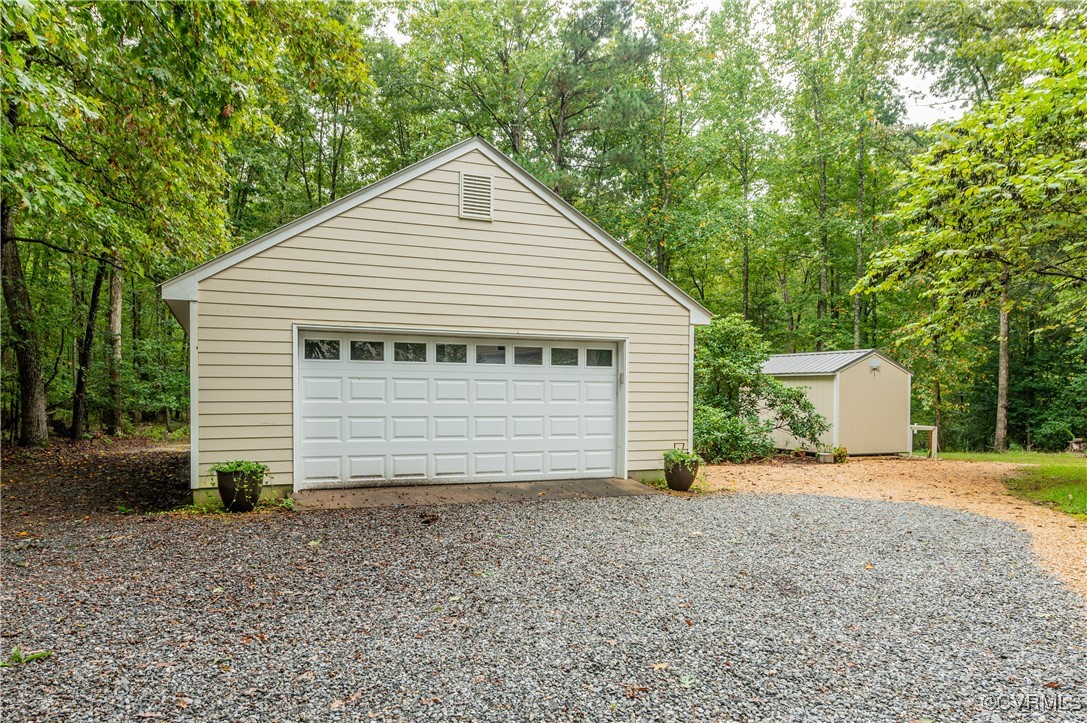 13321 Hensley Road Chesterfield, VA 23832 - Photo 43 of 48 a view of a house with a yard and garage