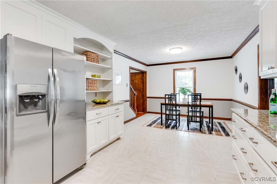 13321 Hensley Road Chesterfield, VA 23832 - Photo 10 of 48 a kitchen with stainless steel appliances granite countertop a refrigerator and a stove top oven