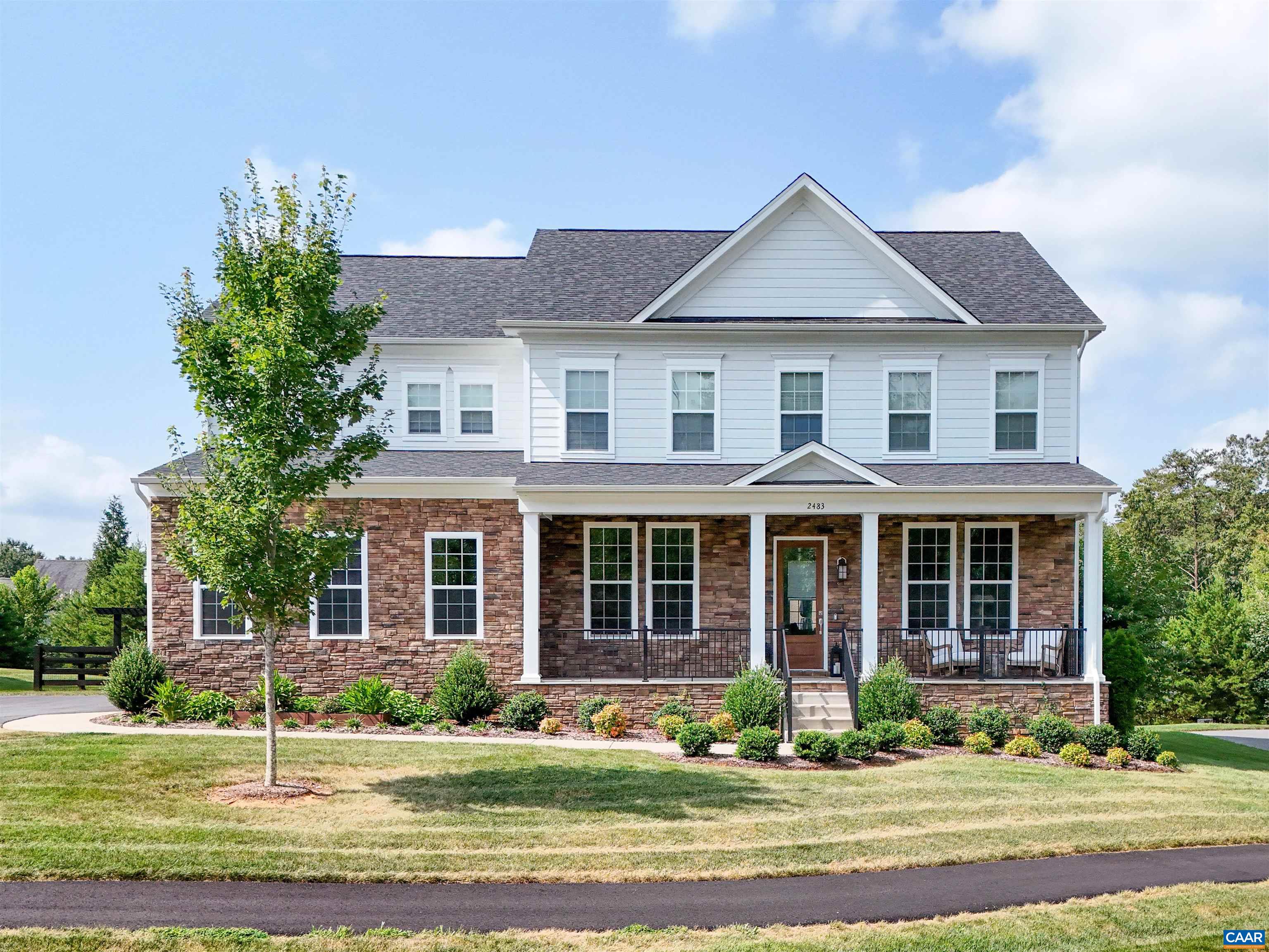 2483 Ferndown Lane Keswick, VA 22947 - Photo 1 of 54 a front view of a house with a yard