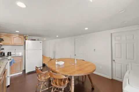 a view of a kitchen with a table and chairs