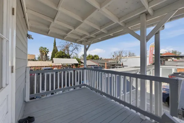 a view of a porch with wooden floor