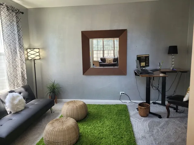 a living room with furniture and a window