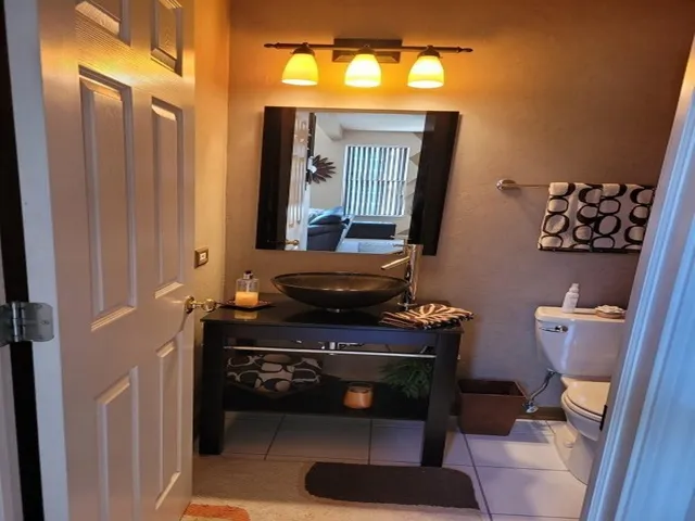 a living room with a table chairs and a fireplace