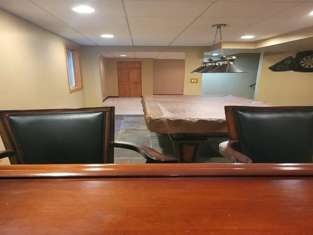 a lobby with furniture and a flat screen tv