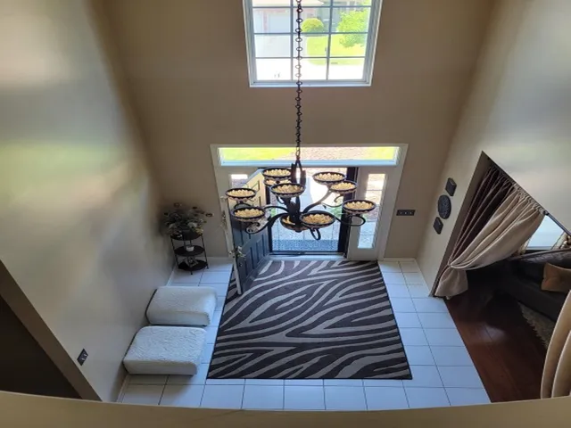 a living room with furniture rug and a table