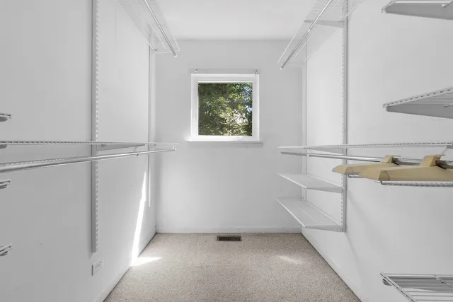 a view of a room that has a window in it