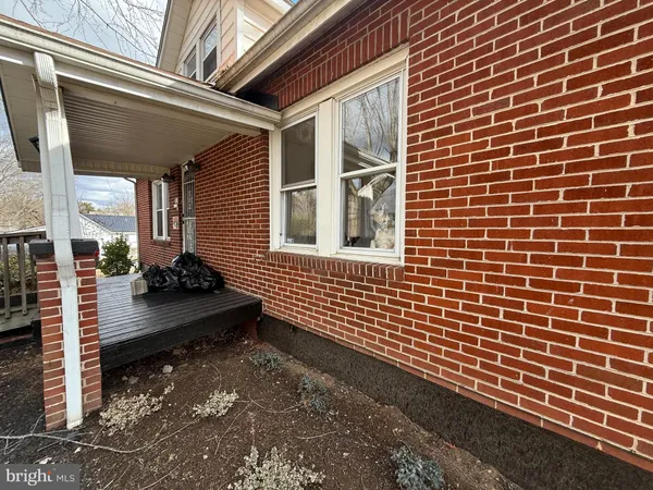 a front view of a house with a large window