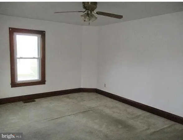 a bathroom with a sink and a window