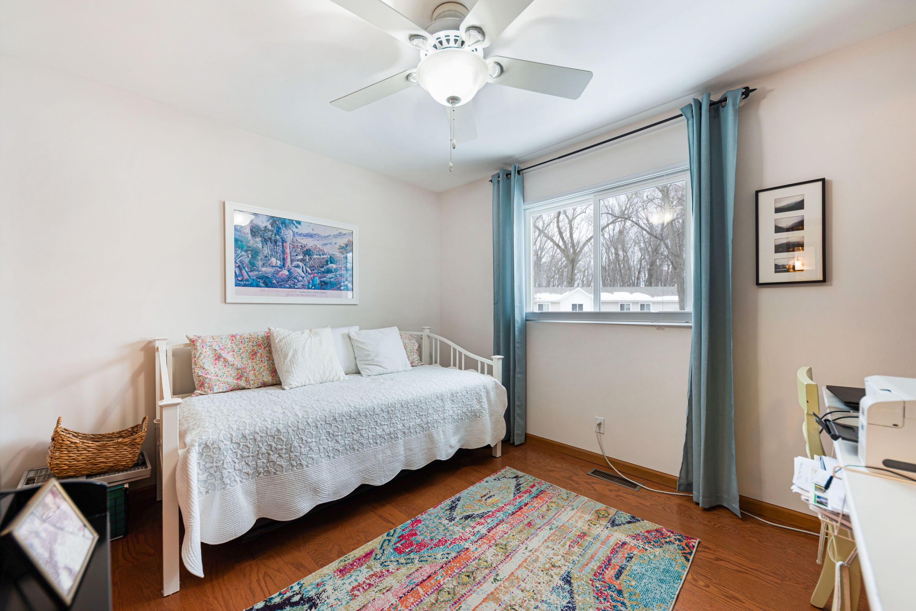 162 Indian Rdg Drive Michigan City, IN 46360 - Photo 13 of 17 a bedroom with a bed and a chandelier