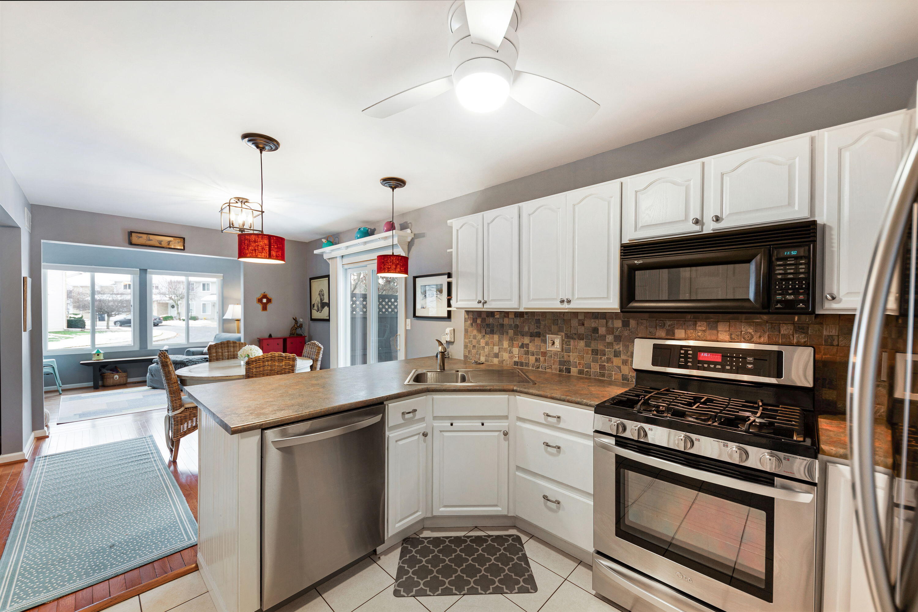 162 Indian Rdg Drive Michigan City, IN 46360 - Photo 10 of 17 a kitchen that has a lot of white cabinets and stainless steel appliances