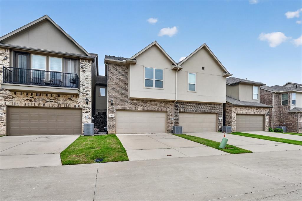 4224 Riverside Drive Flower Mound, TX 75028 - Photo 3 of 23 a front view of a house with a yard and garage