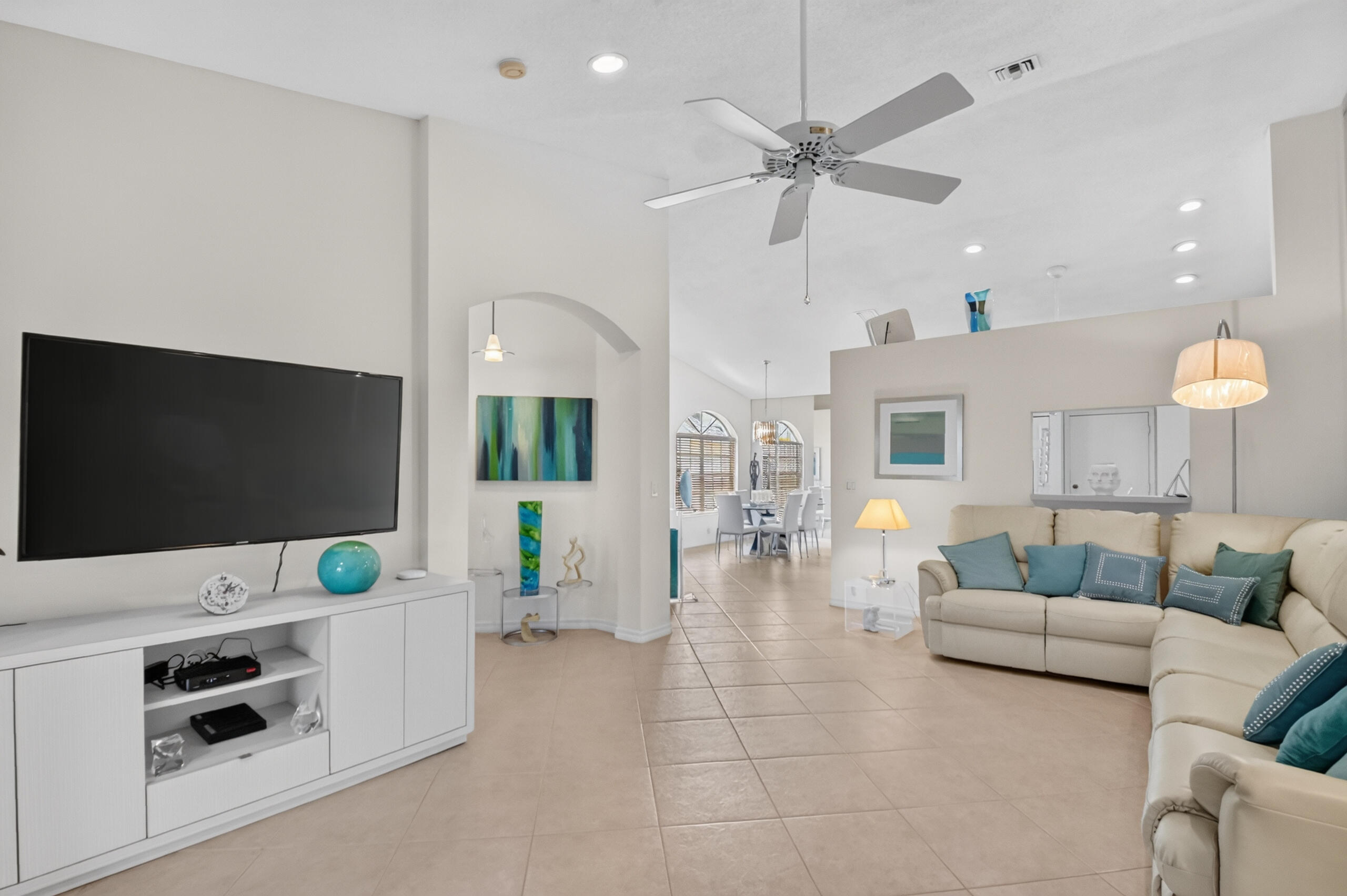 15340 Floral Club Road Delray Beach, FL 33484 - Photo 17 of 42 a living room with furniture and a flat screen tv