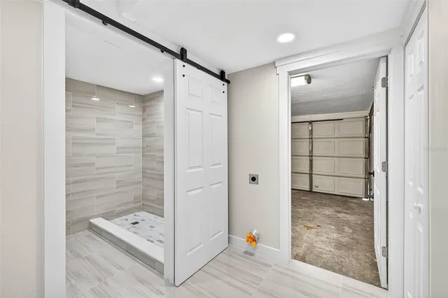 a bathroom with a shower and a sink