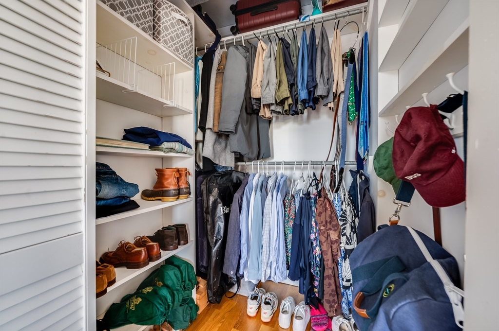 39 Emerson Street Boston, MA 02127 - Photo 13 of 20 a view of walk in closet with clothes and shoes