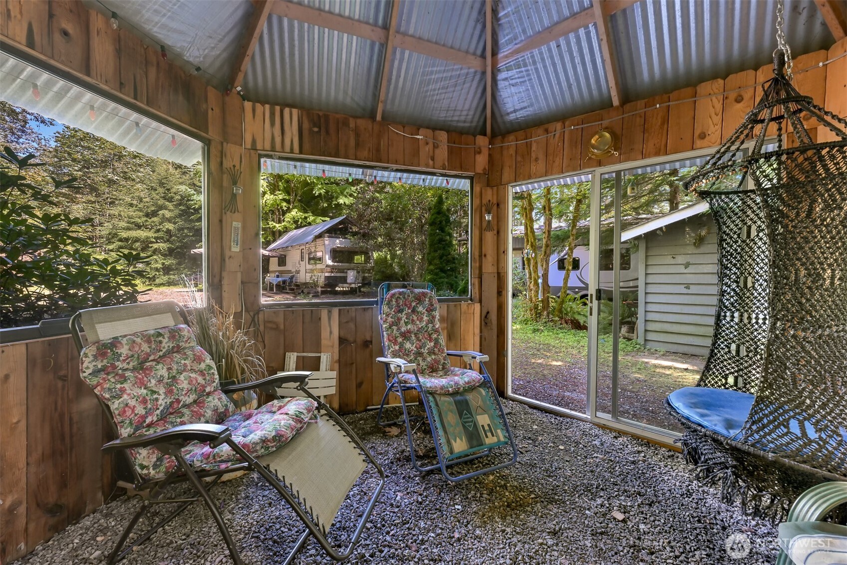3013 Tower Road Maple Falls, WA 98266 - Photo 12 of 38 a view of a patio with a table chairs and a tub