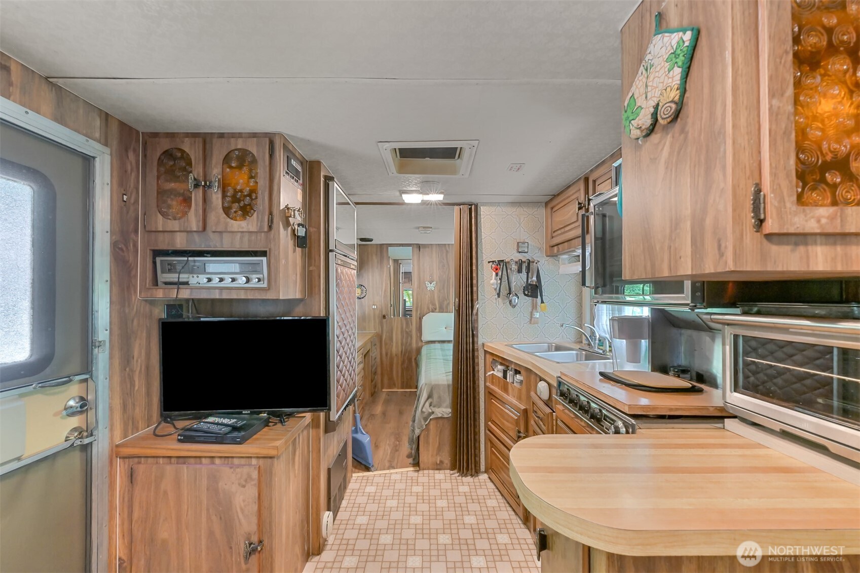 3013 Tower Road Maple Falls, WA 98266 - Photo 4 of 38 a kitchen with stainless steel appliances kitchen island granite countertop a refrigerator a stove top oven a sink and dishwasher