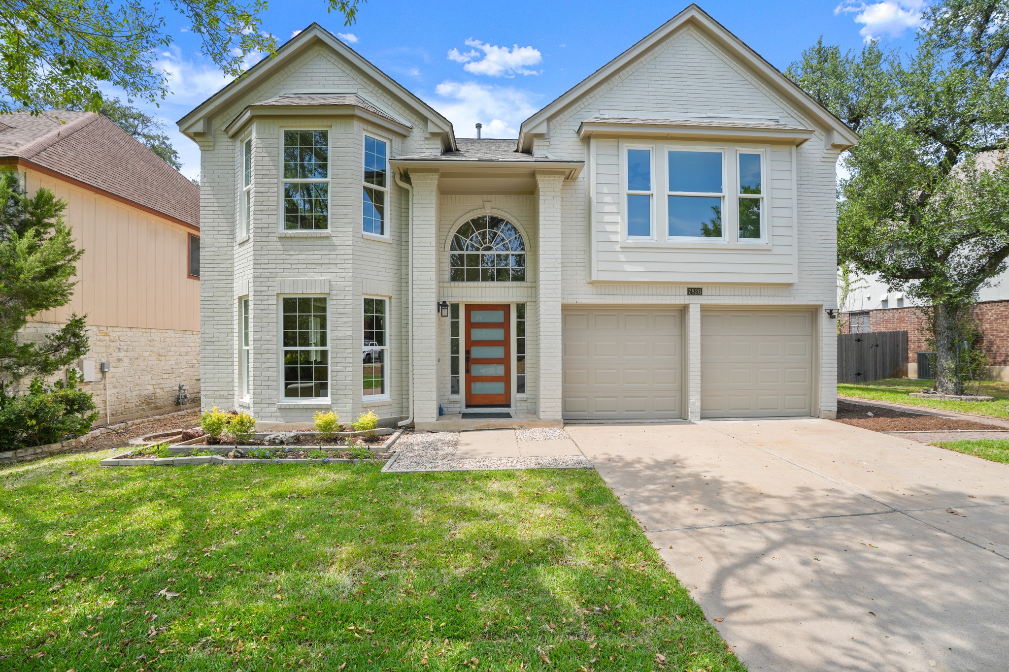 7826 Wheel Rim Circle Austin, TX 78749 - Photo 1 of 38 A classic two-story brick exterior highlights the front facade of this elegant suburban home.