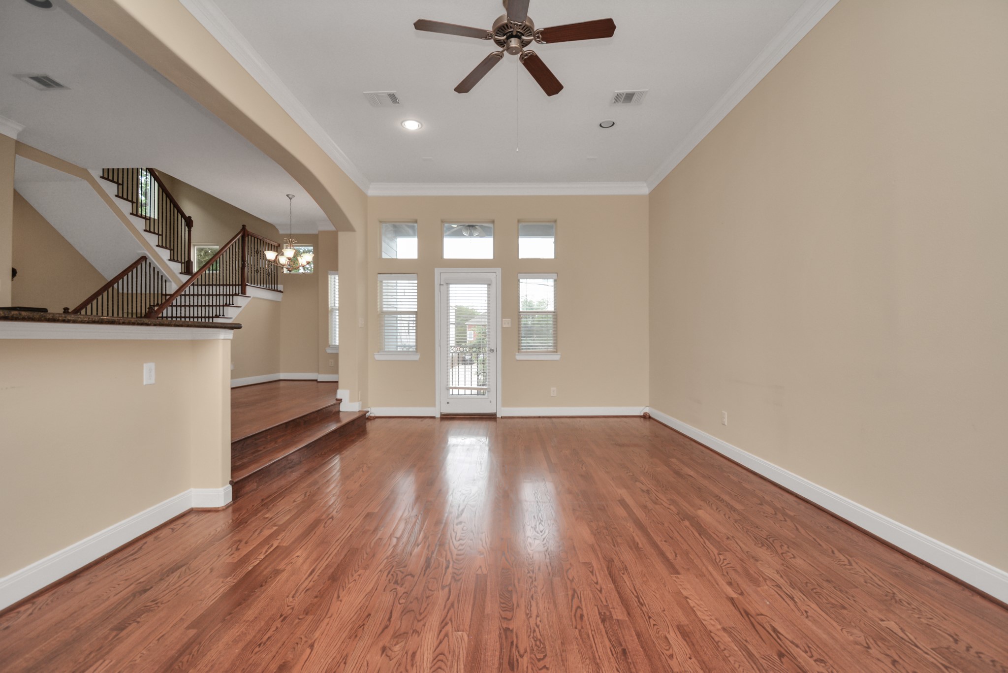 1137 West 24th Street, Unit A Houston, TX 77008 - Photo 35 of 40 a view of an empty room with a window and wooden floor
