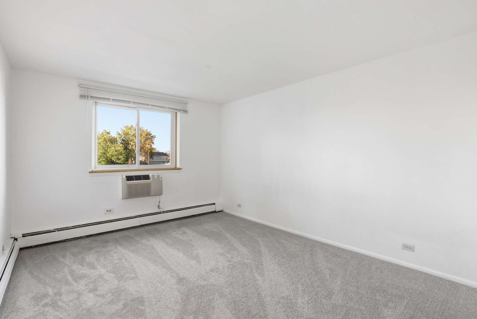 1375 Rebecca Drive, Unit 213 Hoffman Estates, IL 60169 - Photo 13 of 21 an empty room with windows