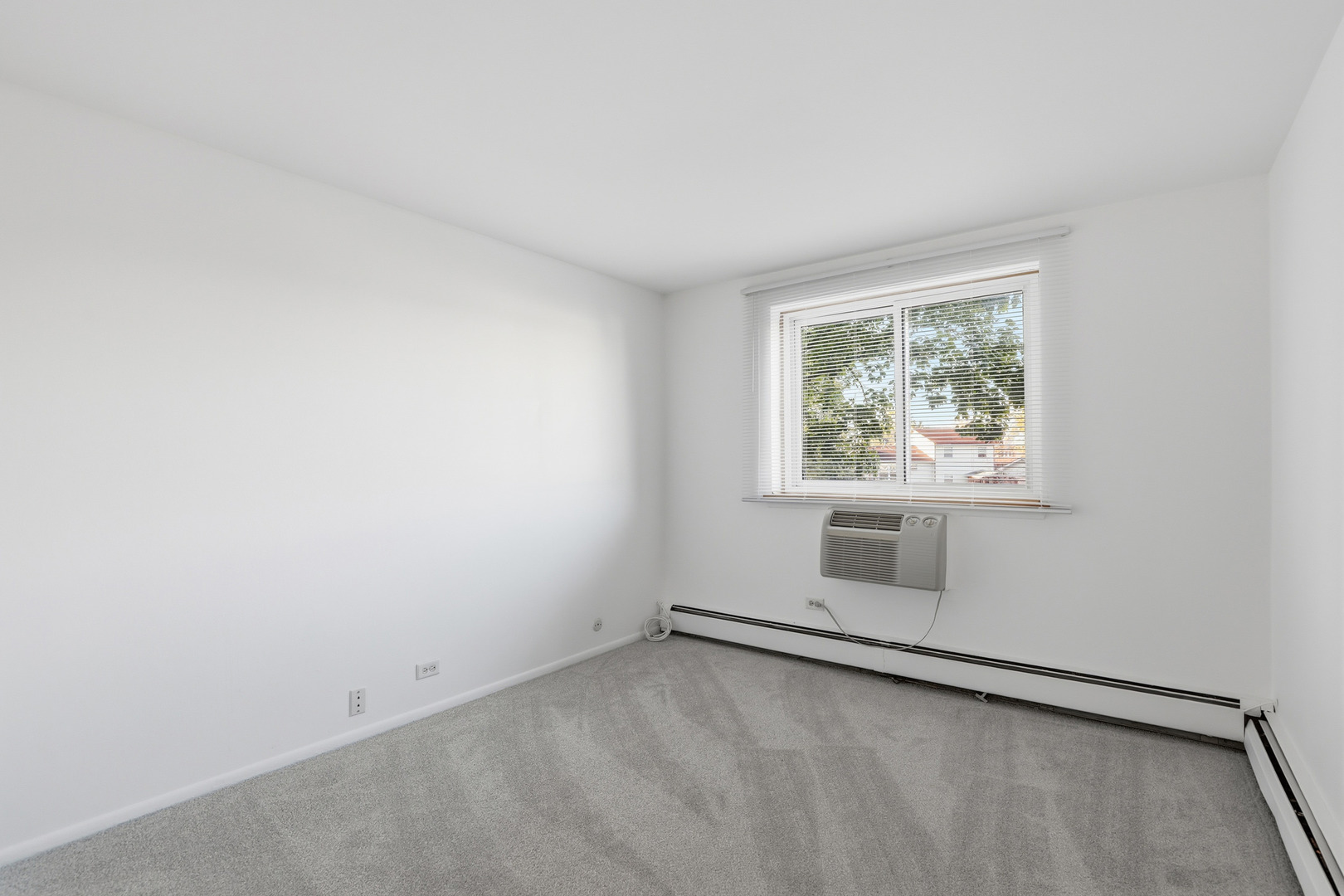 1375 Rebecca Drive, Unit 213 Hoffman Estates, IL 60169 - Photo 14 of 21 an empty room with windows