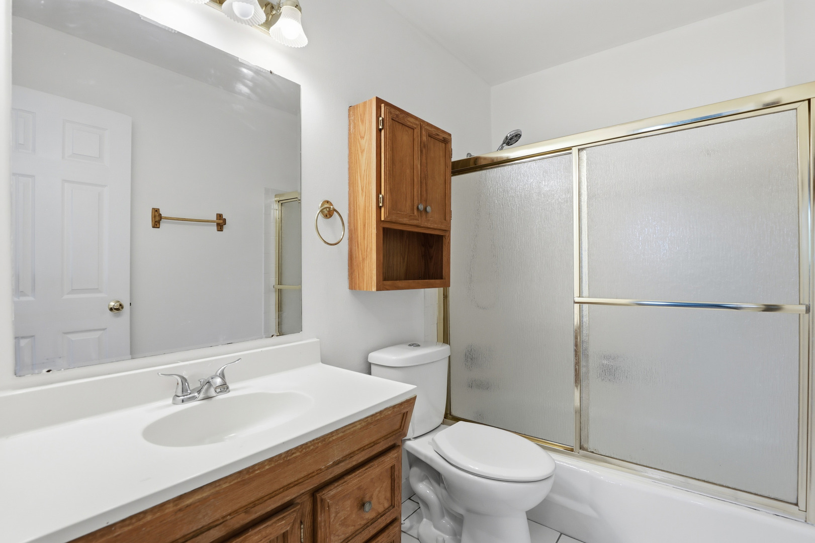 1375 Rebecca Drive, Unit 213 Hoffman Estates, IL 60169 - Photo 17 of 21 a bathroom with a sink toilet and shower