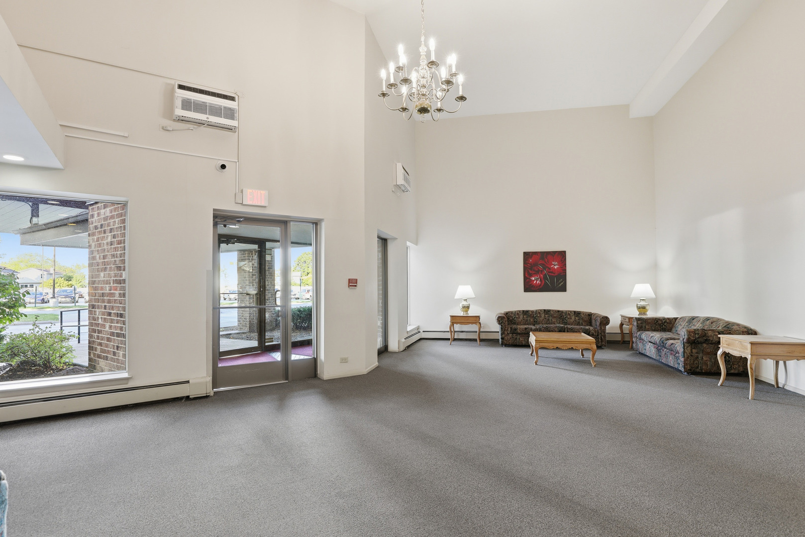 1375 Rebecca Drive, Unit 213 Hoffman Estates, IL 60169 - Photo 19 of 21 a view of a livingroom with furniture and window