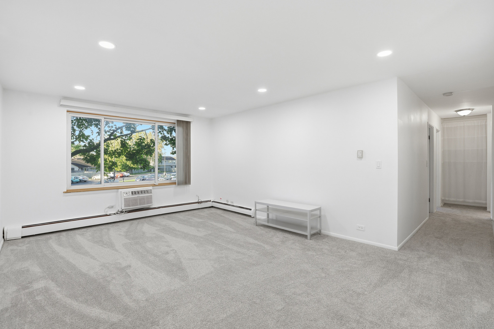 1375 Rebecca Drive, Unit 213 Hoffman Estates, IL 60169 - Photo 5 of 21 an empty room with windows