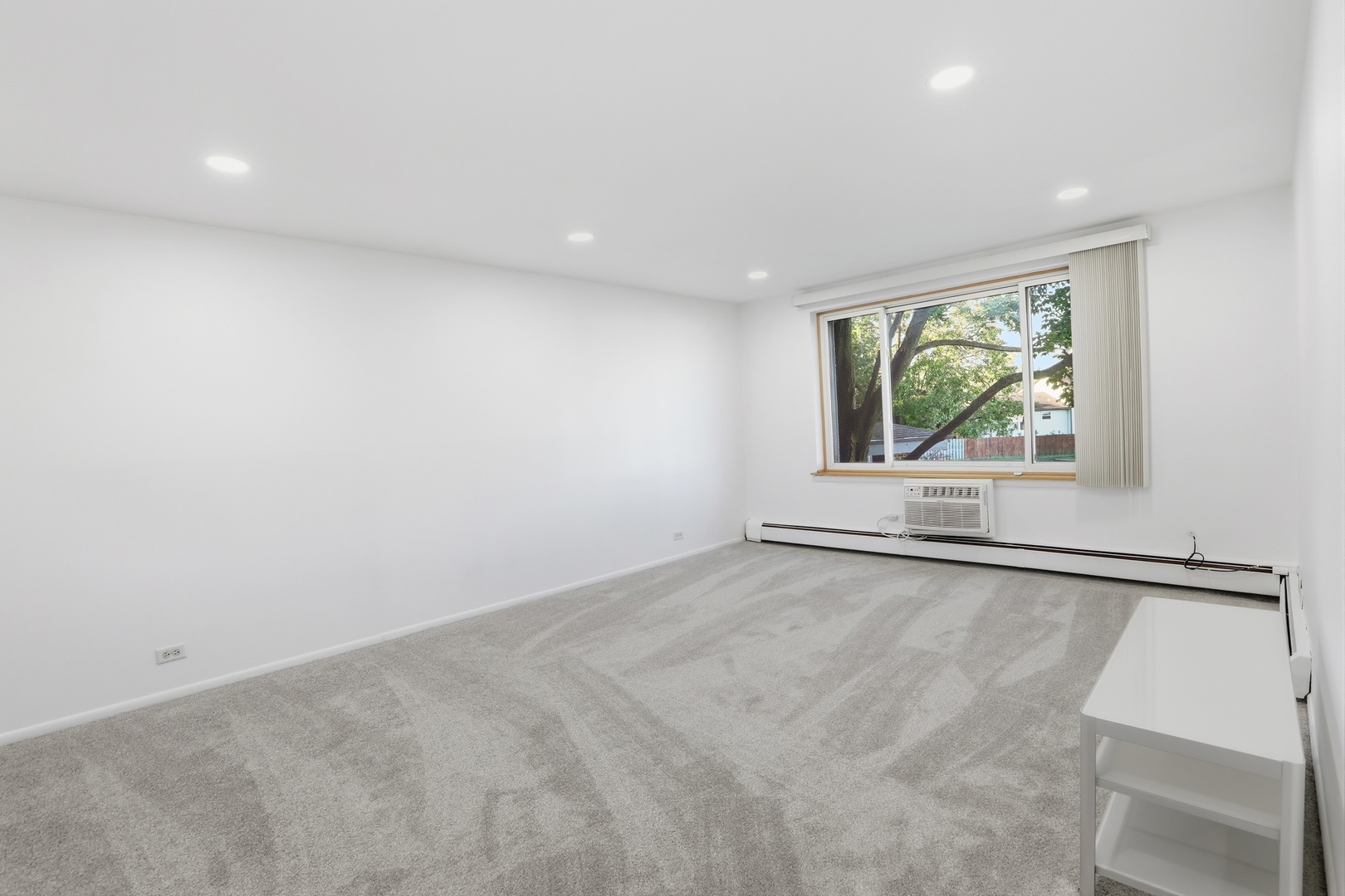 1375 Rebecca Drive, Unit 213 Hoffman Estates, IL 60169 - Photo 7 of 21 an empty room with windows