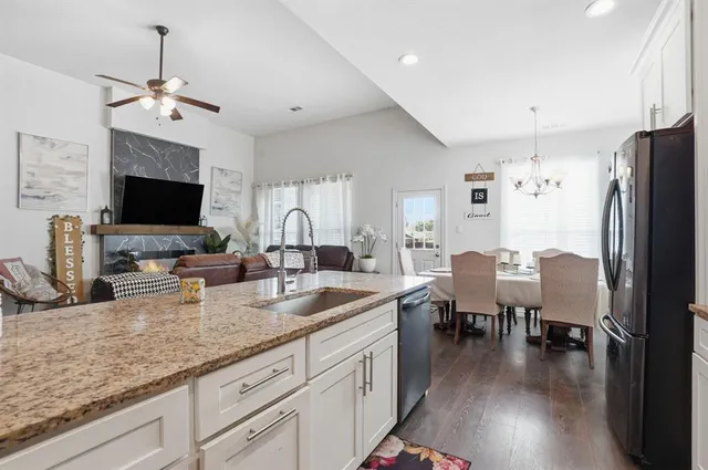 a view of a backyard with a garden and trees