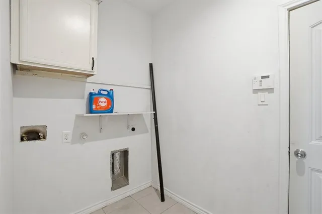 a open kitchen with stainless steel appliances granite countertop a stove a refrigerator a kitchen island a dining table and chairs with wooden floor