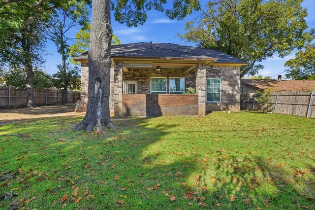a bath tub sitting next to a white sink